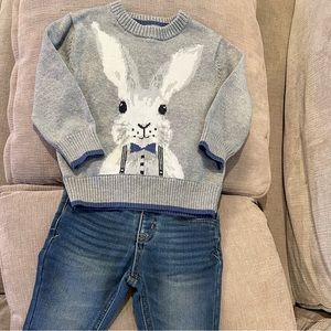 Bunny sweater and jeans with suspenders.